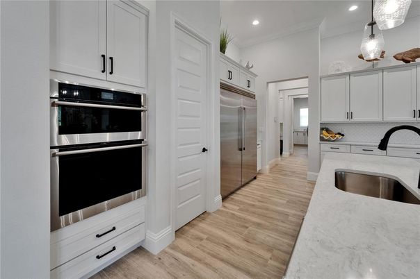 Interior, Kitchen, Pendant Lights, Recessed Lighting, Stainless Steel Appliances, Wood Texture Flooring