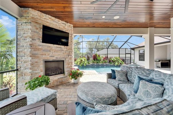 Fireplace, Glass Ceilings, Interior, Living room, Pool, Stone Walls, Sun Room