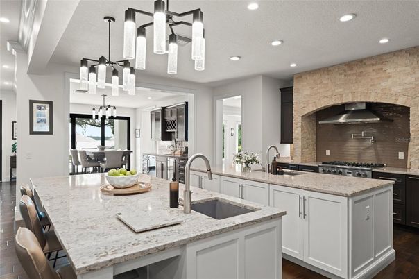 Dining room, Interior, Kitchen, Pendant Lights, Recessed Lighting, Stainless Steel Appliances, Stone Walls, Wood Texture Flooring