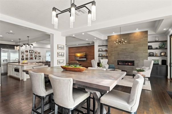 Dining room, Fireplace, Interior, Kitchen, Living room, Pendant Lights, Recessed Lighting, Stainless Steel Appliances, Stone Walls, Wood Texture Flooring, Wooden Walls