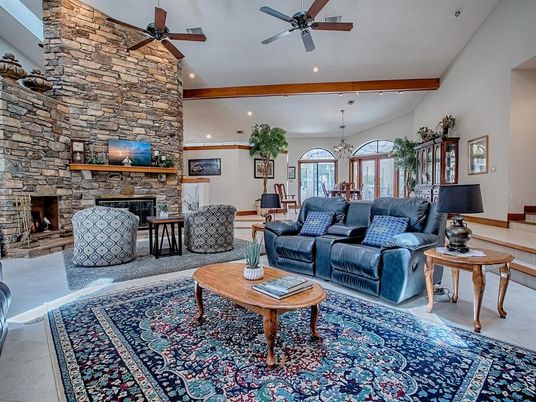 Chandelier, Fireplace, Interior, Living room, Recessed Lighting, Stone Walls, Wooden Beams