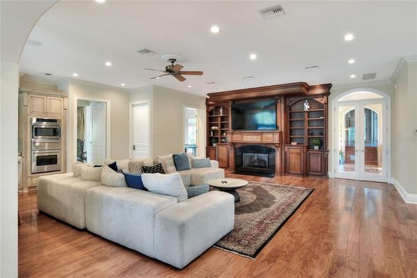 Fireplace, Interior, Kitchen, Living room, Recessed Lighting, Stainless Steel Appliances, Wood Texture Flooring