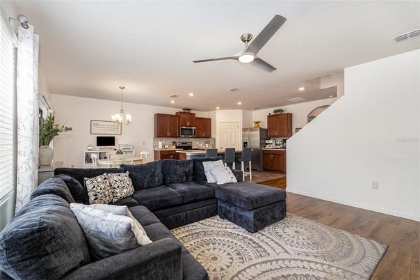 Chandelier, Dining room, Interior, Kitchen, Living room, Pendant Lights, Recessed Lighting, Stainless Steel Appliances, Wood Texture Flooring