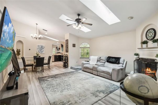 Chandelier, Dining room, Fireplace, Interior, Kitchen, Living room, Recessed Lighting, Wood Texture Flooring