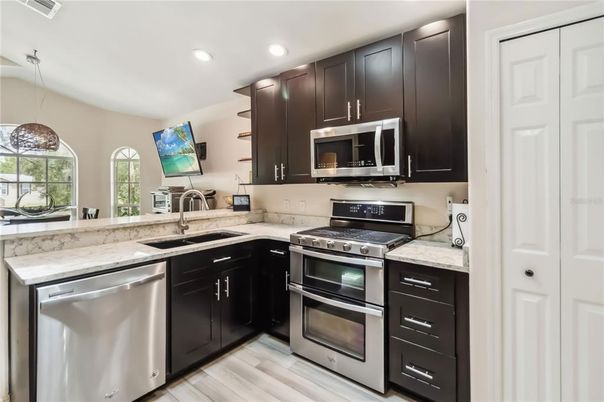 Interior, Kitchen, Pendant Lights, Recessed Lighting, Stainless Steel Appliances, Wood Texture Flooring