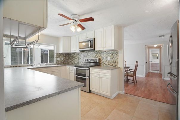 Dining room, Interior, Kitchen, Pendant Lights, Stainless Steel Appliances, Wood Texture Flooring
