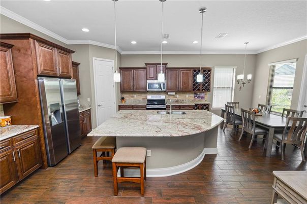 Dining room, Interior, Kitchen, Pendant Lights, Recessed Lighting, Stainless Steel Appliances, Wood Texture Flooring