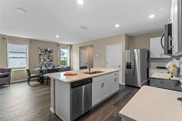 Dining room, Interior, Kitchen, Recessed Lighting, Stainless Steel Appliances, Wood Texture Flooring
