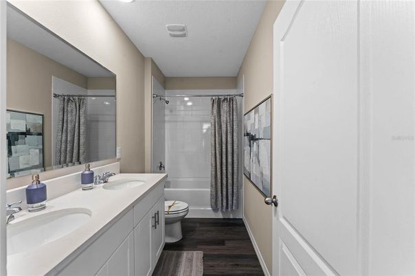 Bathroom, Dual Sink Vanities, Interior, Recessed Lighting, Wood Texture Flooring