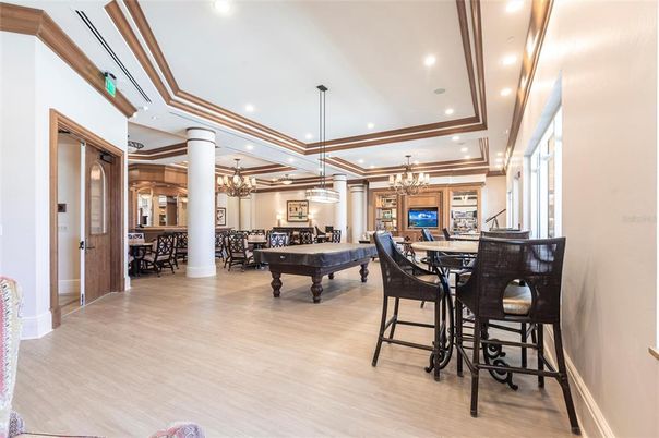 Billiard Table, Chandelier, Dining room, Game Room, Interior, Pendant Lights, Recessed Lighting, Wood Texture Flooring