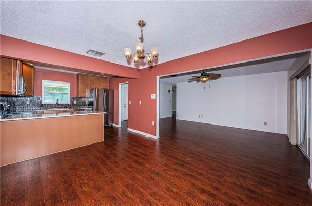 Chandelier, Empty room, Interior, Kitchen, Stainless Steel Appliances, Wood Texture Flooring