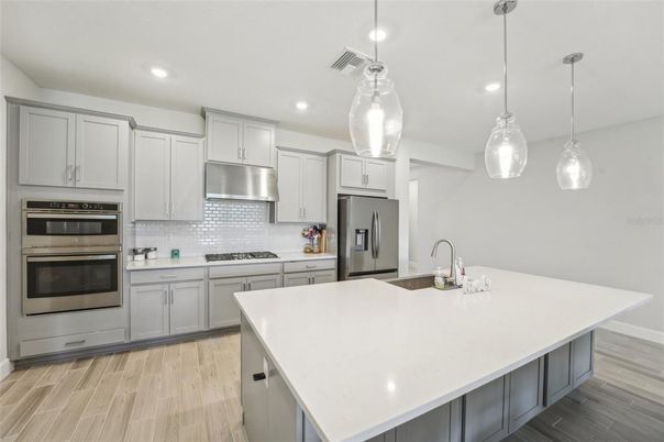 Interior, Kitchen, Pendant Lights, Recessed Lighting, Stainless Steel Appliances, Wood Texture Flooring