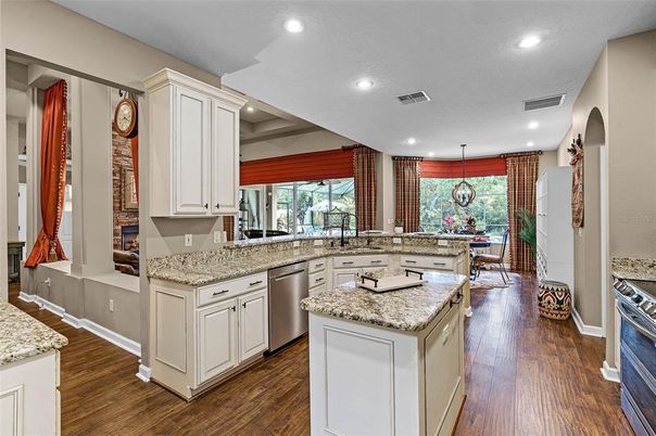 Dining room, Interior, Kitchen, Pendant Lights, Recessed Lighting, Stainless Steel Appliances, Wood Texture Flooring