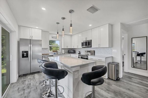 Interior, Kitchen, Pendant Lights, Recessed Lighting, Stainless Steel Appliances, Wood Texture Flooring