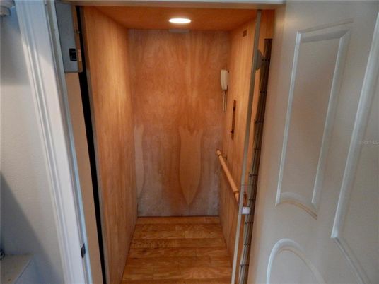 Elevator, Interior, Recessed Lighting, Wood Texture Flooring, Wooden Walls