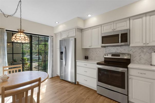 Interior, Kitchen, Pendant Lights, Recessed Lighting, Stainless Steel Appliances, Wood Texture Flooring
