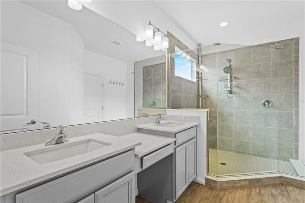 Bathroom, Dual Sink Vanities, Glass Shower, Interior, Recessed Lighting, Wood Texture Flooring