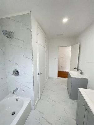 Bathroom, Dual Sink Vanities, Interior, Marble, Marble Walls, Recessed Lighting
