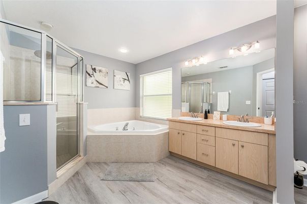 Bathroom, Dual Sink Vanities, Glass Shower, Interior, Recessed Lighting, Wood Texture Flooring