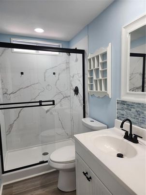 Bathroom, Glass Shower, Interior, Marble Walls, Recessed Lighting, Wood Texture Flooring