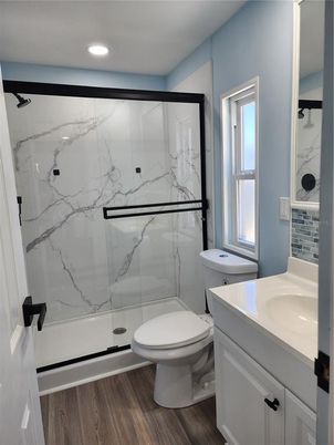 Bathroom, Glass Shower, Interior, Marble Walls, Recessed Lighting, Wood Texture Flooring
