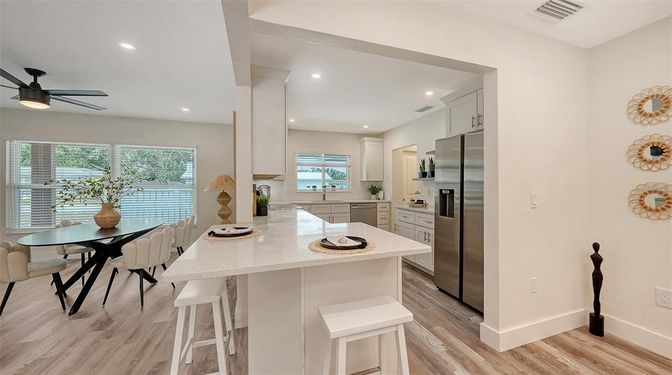 Dining room, Interior, Kitchen, Recessed Lighting, Stainless Steel Appliances, Wood Texture Flooring