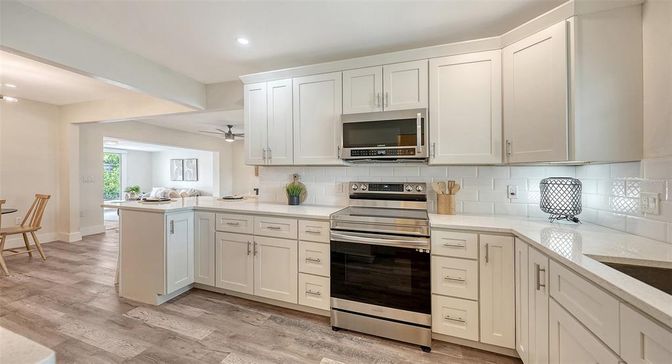 Interior, Kitchen, Recessed Lighting, Stainless Steel Appliances, Wood Texture Flooring