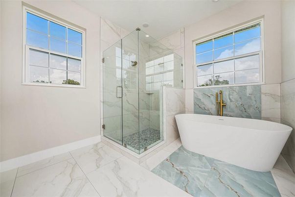 Bathroom, Free Standing Baths, Glass Shower, Interior, Marble, Marble Walls, Recessed Lighting
