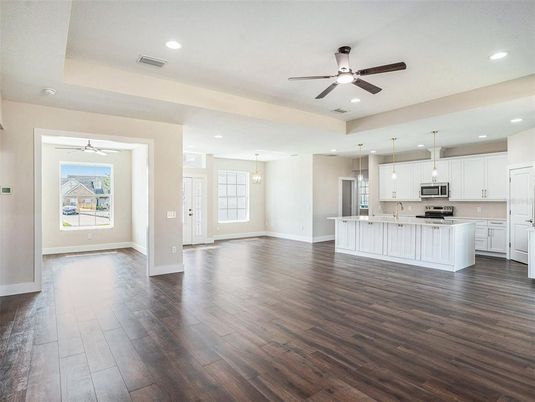 Empty room, Interior, Kitchen, Pendant Lights, Recessed Lighting, Stainless Steel Appliances, Wood Texture Flooring