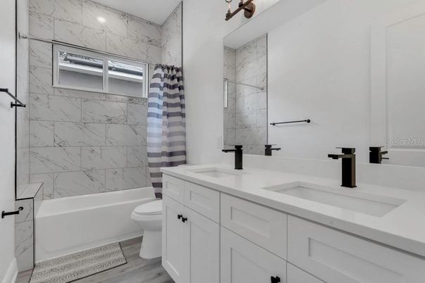 Bathroom, Dual Sink Vanities, Interior, Marble Walls, Wood Texture Flooring