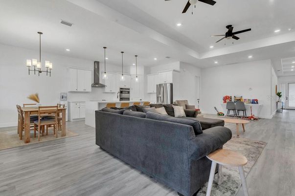 Dining room, Interior, Kitchen, Living room, Pendant Lights, Recessed Lighting, Stainless Steel Appliances, Wood Texture Flooring