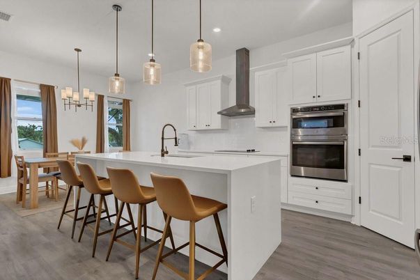 Dining room, Interior, Kitchen, Pendant Lights, Recessed Lighting, Stainless Steel Appliances, Wood Texture Flooring
