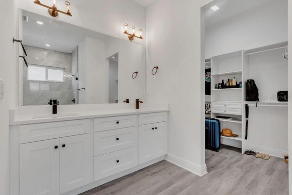 Bathroom, Dual Sink Vanities, Interior, Recessed Lighting, Wood Texture Flooring