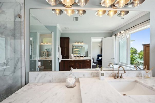Bathroom, Chandelier, Dual Sink Vanities, Glass Shower, Interior, Marble Walls