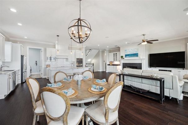 Chandelier, Dining room, Fireplace, Interior, Kitchen, Living room, Pendant Lights, Recessed Lighting, Wood Texture Flooring