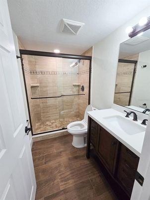 Bathroom, Dual Sink Vanities, Glass Shower, Interior, Recessed Lighting, Wood Texture Flooring