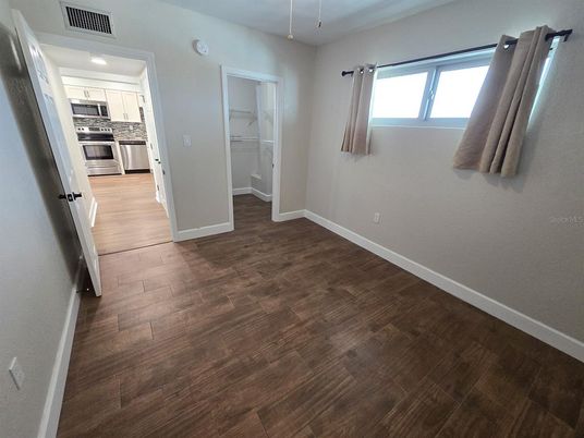 Empty room, Interior, Kitchen, Stainless Steel Appliances, Wood Texture Flooring