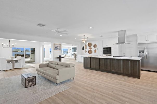Dining room, Interior, Kitchen, Living room, Pendant Lights, Recessed Lighting, Stainless Steel Appliances, Wood Texture Flooring