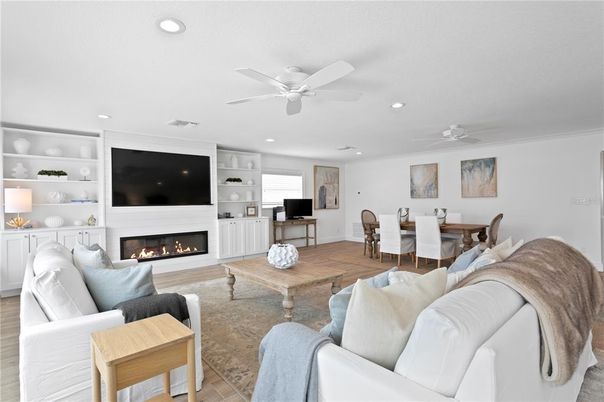 Dining room, Fireplace, Interior, Living room, Recessed Lighting, Wood Texture Flooring