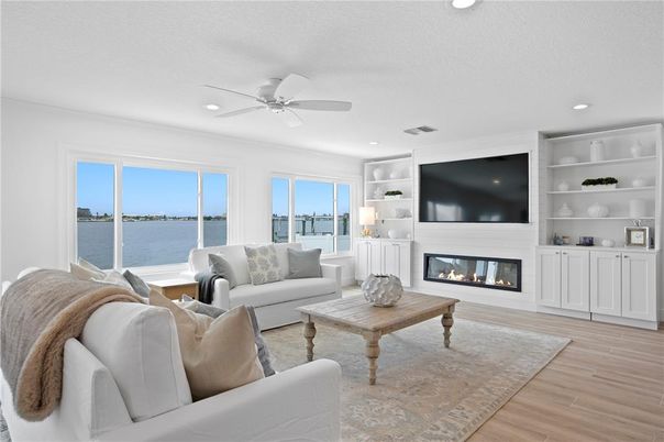 Fireplace, Interior, Living room, Recessed Lighting, Water, Wood Texture Flooring