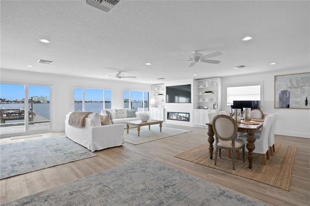 Dining room, Fireplace, Interior, Living room, Recessed Lighting, Water, Wood Texture Flooring