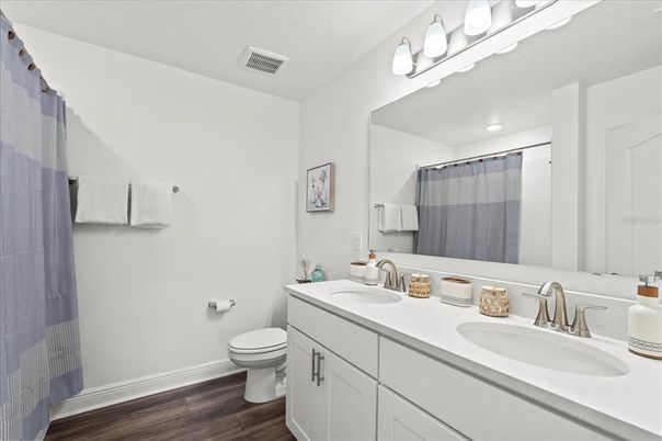 Bathroom, Dual Sink Vanities, Interior, Recessed Lighting, Wood Texture Flooring