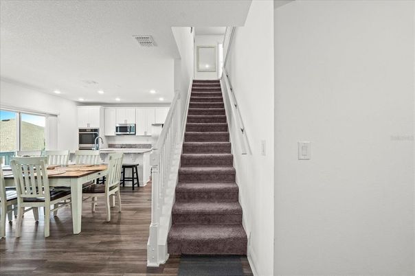 Dining room, Interior, Kitchen, Recessed Lighting, Stainless Steel Appliances, Wood Texture Flooring