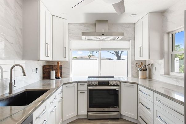 Interior, Kitchen, Marble Walls, Recessed Lighting, Stainless Steel Appliances