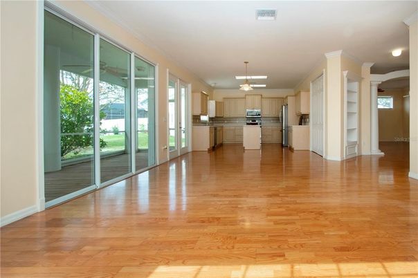 Empty room, Interior, Kitchen, Pendant Lights, Stainless Steel Appliances, Wood Texture Flooring