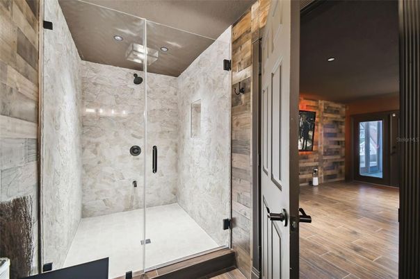 Bathroom, Glass Shower, Interior, Marble Walls, Recessed Lighting, Wood Texture Flooring, Wooden Walls