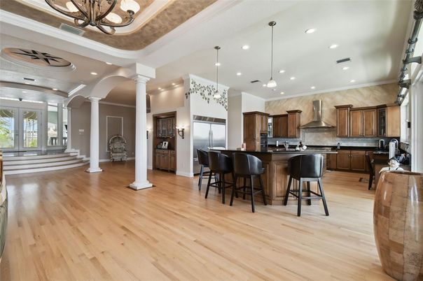 Chandelier, Interior, Kitchen, Pendant Lights, Recessed Lighting, Stainless Steel Appliances, Wood Texture Flooring