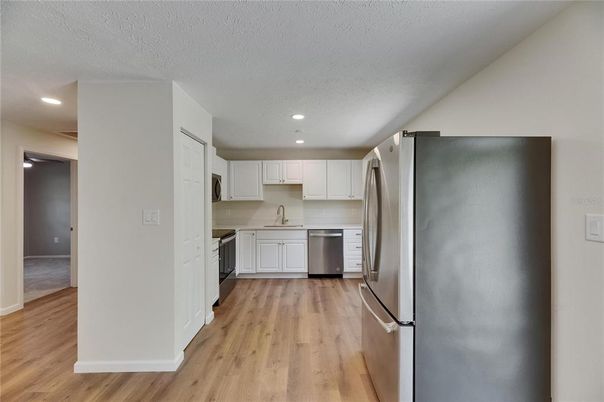 Interior, Kitchen, Recessed Lighting, Stainless Steel Appliances, Wood Texture Flooring