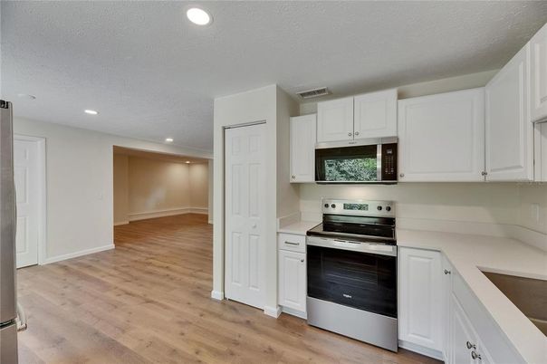 Interior, Kitchen, Recessed Lighting, Stainless Steel Appliances, Wood Texture Flooring