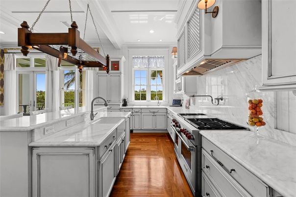 Interior, Kitchen, Marble Walls, Pendant Lights, Recessed Lighting, Stainless Steel Appliances, Wood Texture Flooring